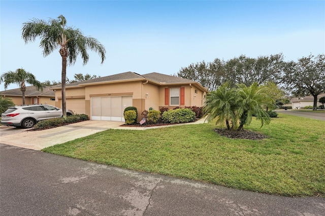 view of front of property featuring a garage and a front yard