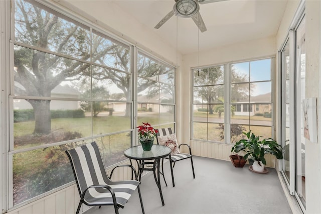 sunroom featuring plenty of natural light and ceiling fan