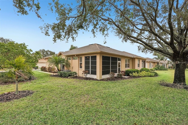 rear view of property with a yard