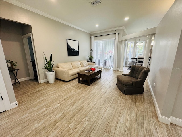 living room with light hardwood / wood-style floors and crown molding