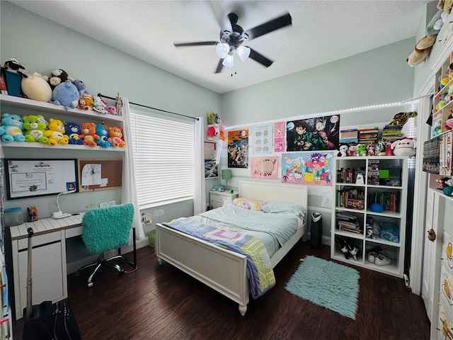 bedroom featuring dark wood-type flooring and ceiling fan