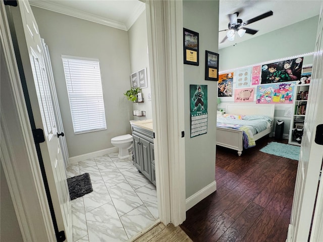 bedroom with ceiling fan and ornamental molding