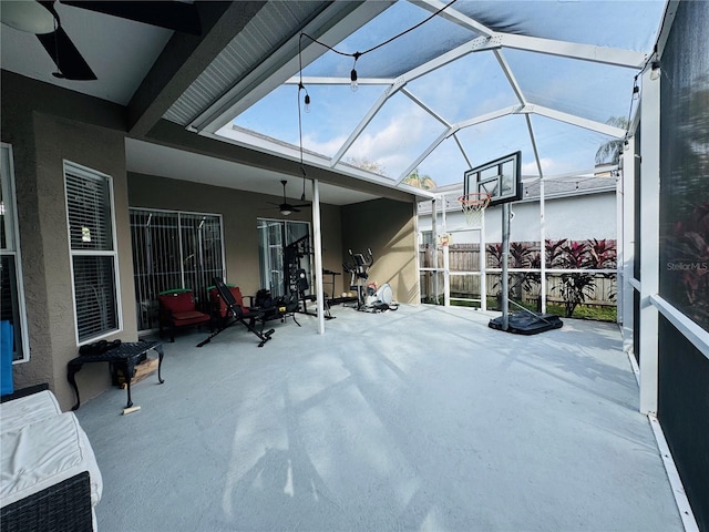 view of patio / terrace featuring a lanai and ceiling fan