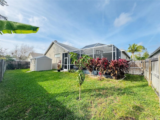 view of yard with a lanai and a storage shed