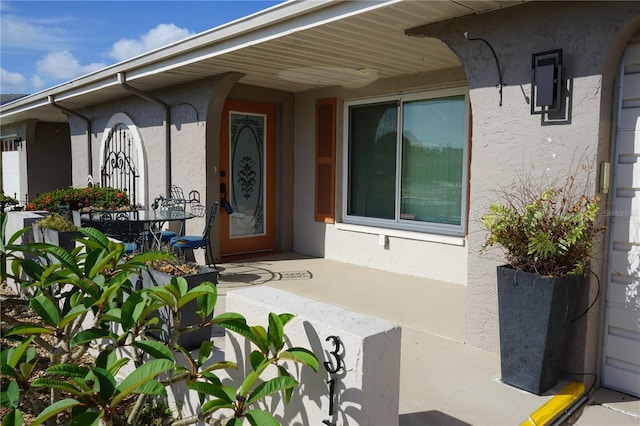 doorway to property featuring a patio