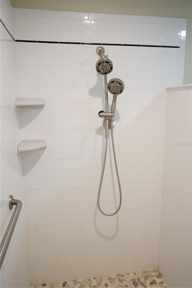 bathroom with a tile shower