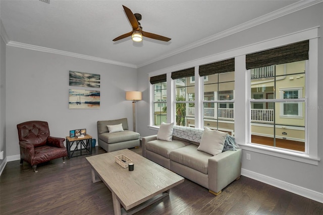 living room featuring crown molding, dark wood-type flooring, a wealth of natural light, and ceiling fan