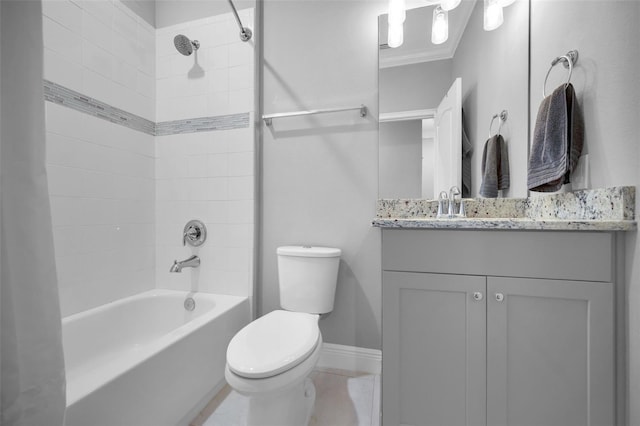 full bathroom with tiled shower / bath, vanity, ornamental molding, toilet, and tile patterned floors