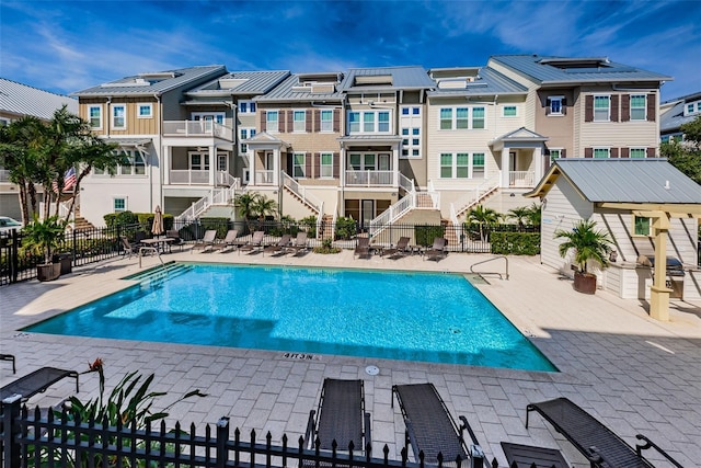 view of swimming pool with a patio