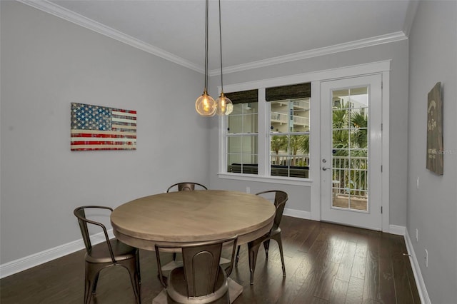 dining room featuring ornamental molding and dark hardwood / wood-style floors