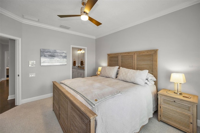 bedroom with ceiling fan, ensuite bath, crown molding, and light colored carpet