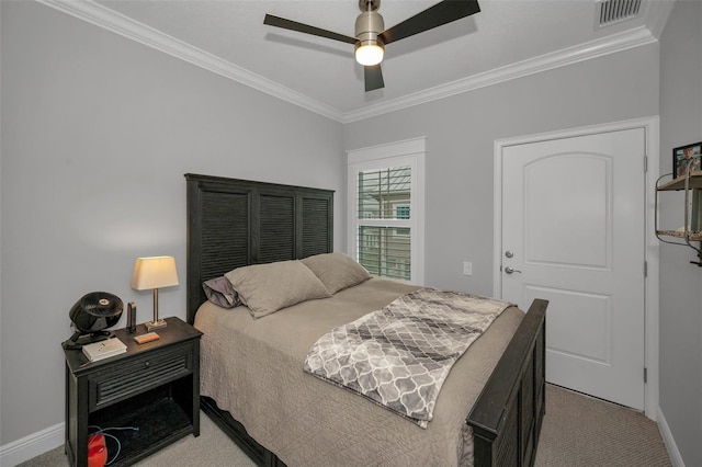 carpeted bedroom with crown molding and ceiling fan