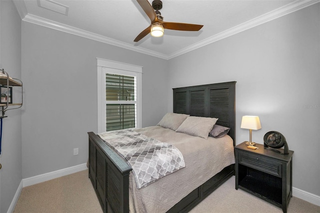 carpeted bedroom featuring ornamental molding and ceiling fan