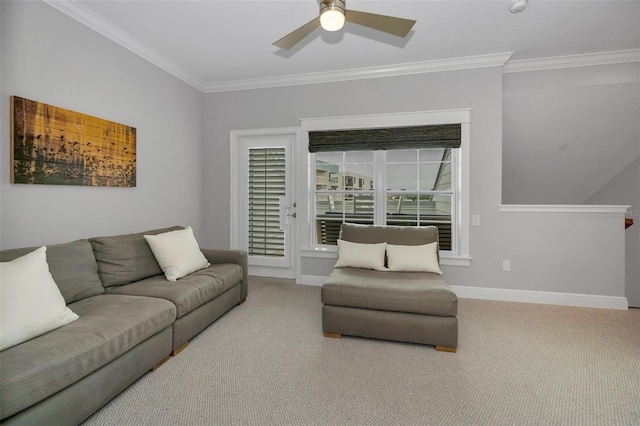 living room featuring crown molding, ceiling fan, and carpet floors