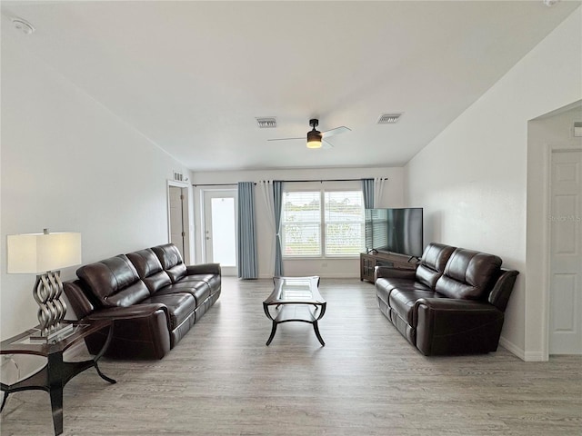 living room featuring ceiling fan and light hardwood / wood-style floors