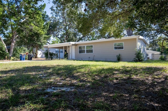 ranch-style home with a front yard