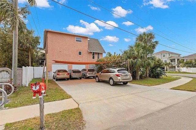 view of home's exterior featuring a garage and a lawn