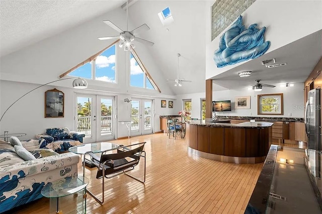 welcome area featuring french doors and ceiling fan