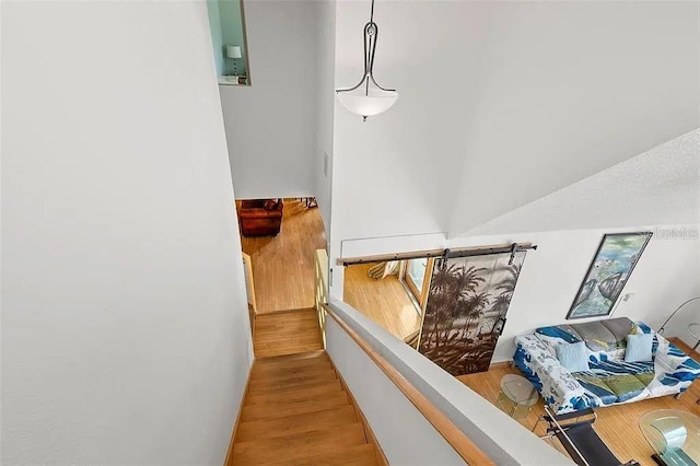 stairs featuring wood-type flooring