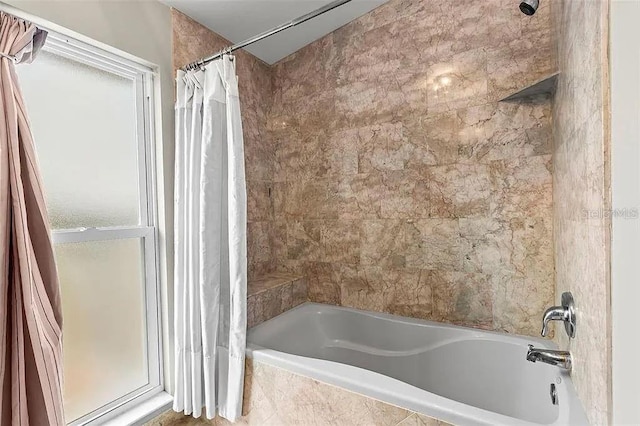 bathroom with shower / tub combo