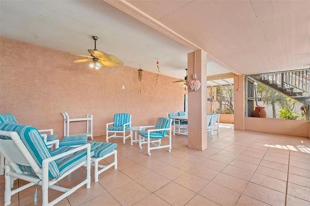 view of patio featuring ceiling fan