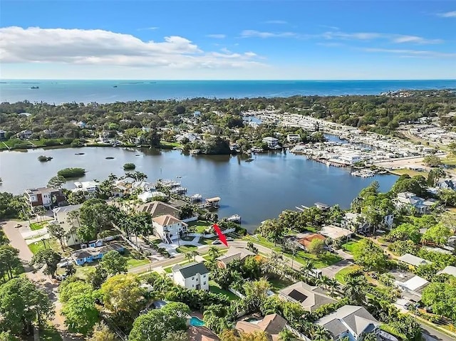 birds eye view of property with a water view