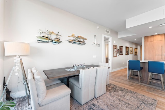 dining room with light hardwood / wood-style flooring