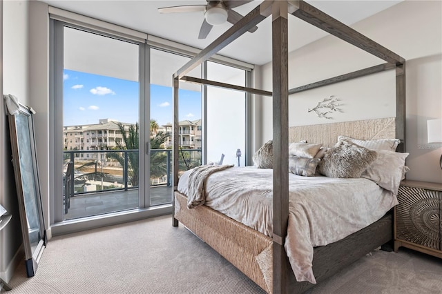 bedroom with access to outside, floor to ceiling windows, ceiling fan, and carpet flooring