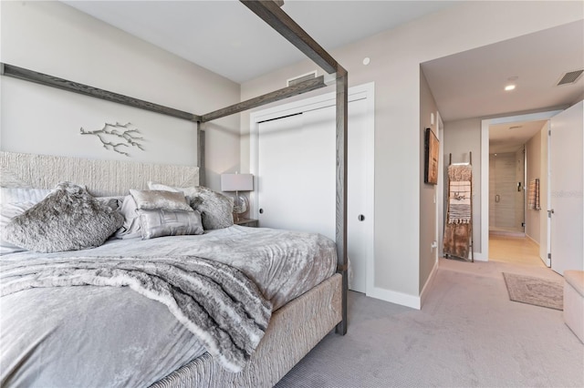 carpeted bedroom with a closet