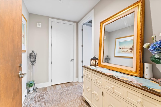 corridor featuring light hardwood / wood-style flooring