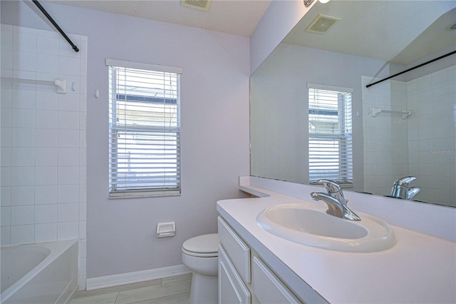 bathroom featuring toilet, baseboards, visible vents, and vanity