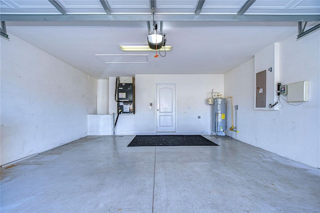 garage with a garage door opener, electric panel, water heater, and heating unit