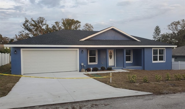 ranch-style home featuring a garage