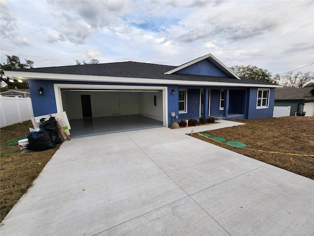 view of front of property with a garage and a porch