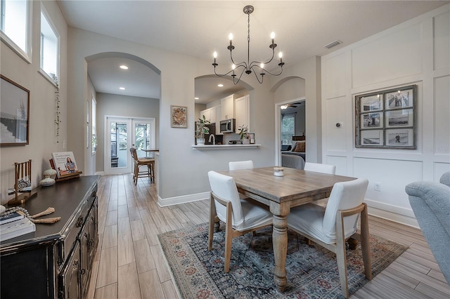 dining area with an inviting chandelier