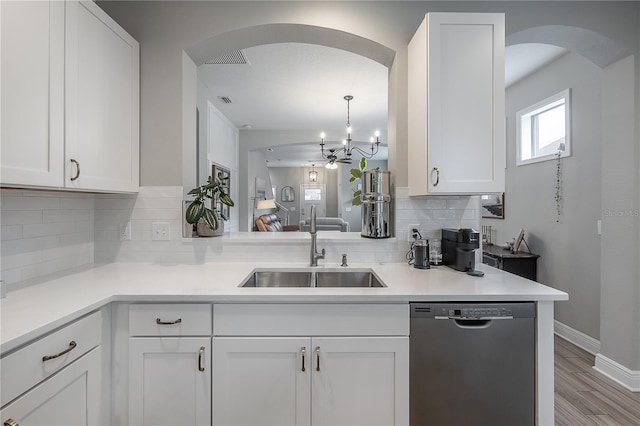 kitchen featuring sink, white cabinetry, and dishwasher