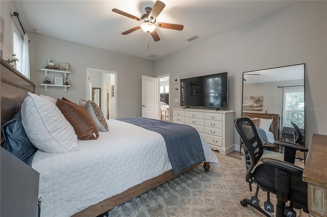 bedroom with ceiling fan and connected bathroom