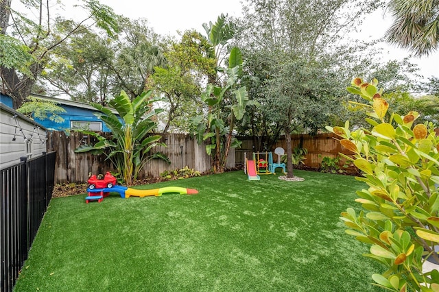 view of yard with a playground