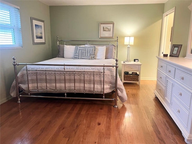 bedroom featuring hardwood / wood-style flooring