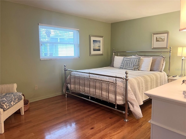 bedroom with hardwood / wood-style flooring