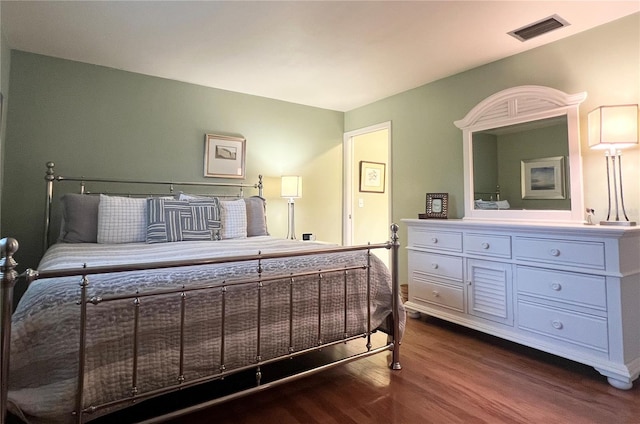 bedroom featuring dark hardwood / wood-style floors