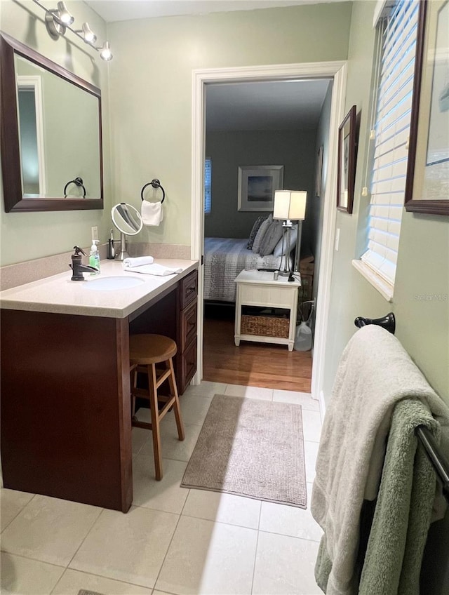 bathroom featuring tile patterned flooring and vanity