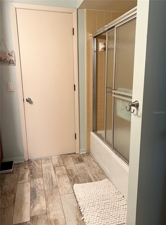 bathroom featuring enclosed tub / shower combo