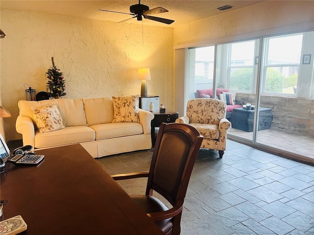 living room featuring ceiling fan