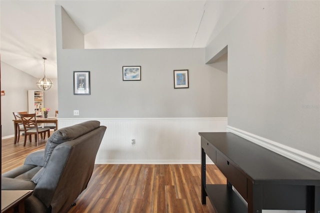 office with vaulted ceiling, dark hardwood / wood-style floors, and a notable chandelier