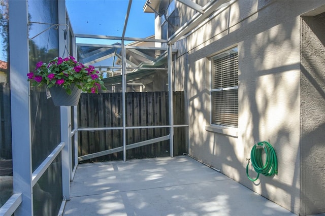 view of patio / terrace featuring a lanai