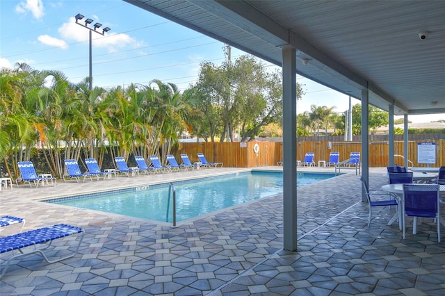 view of swimming pool featuring a patio area