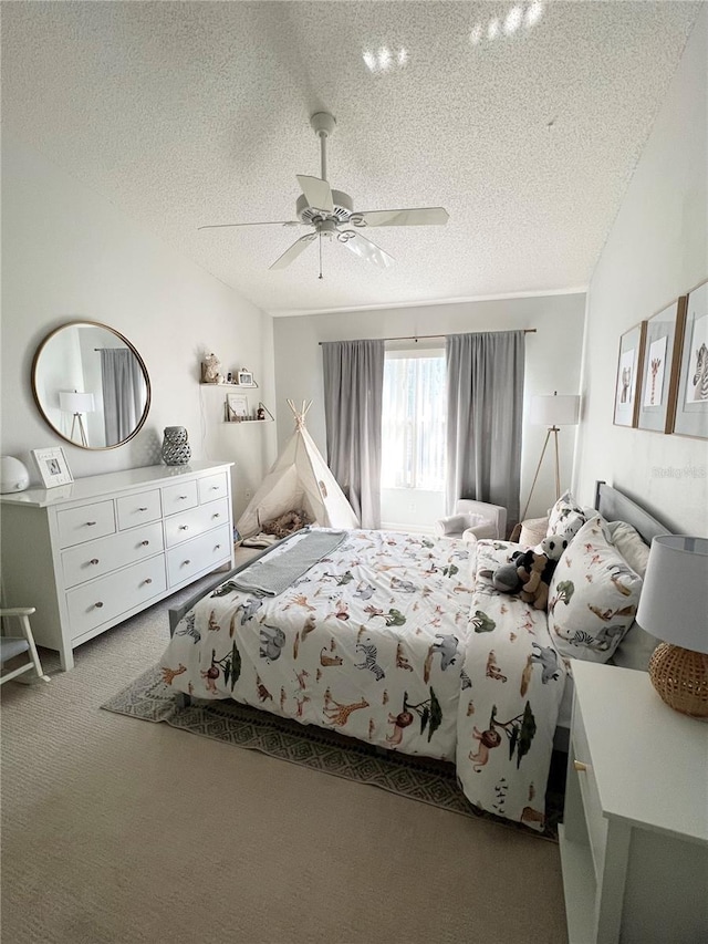 carpeted bedroom with ceiling fan, lofted ceiling, and a textured ceiling