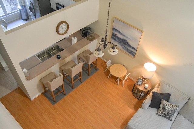 living room with wood-type flooring and sink