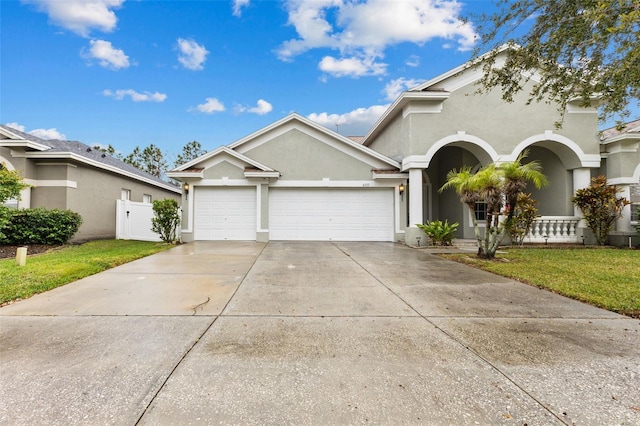 view of front of house with a garage and a front yard